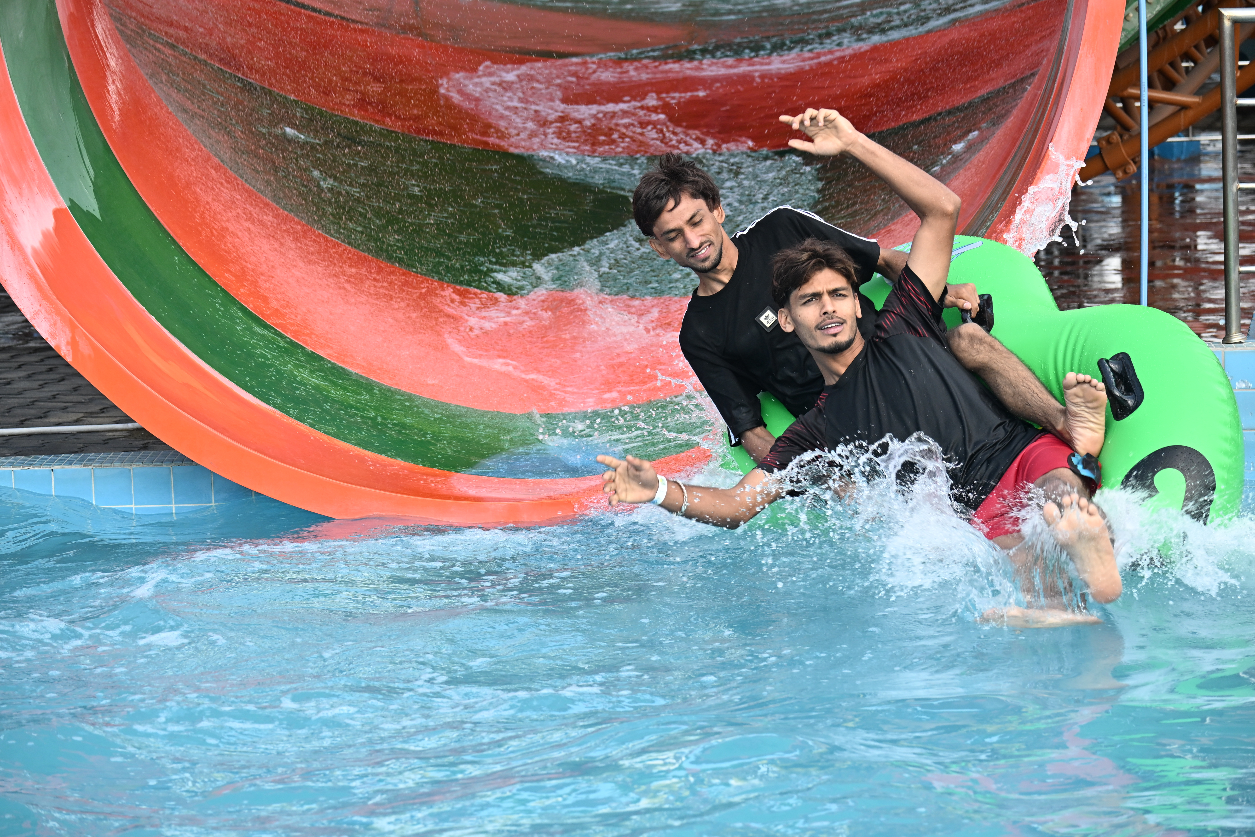 Guests enjoying a water slide at Nicco Park